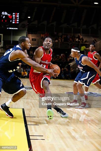 Othyus Jeffers of the Prospects drives to the basket against Justin Hamilton of the Futures during the NBA D-League All-Star Game at Sprint Arena as...