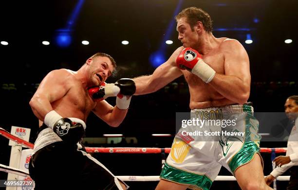 6Tyson Fury of Great Britain catches Joey Abell of USA during their International Heavyweight bout at The Copper Box on February 15, 2014 in London,...