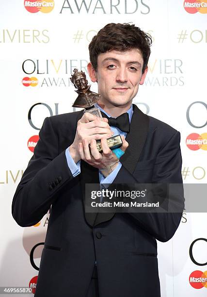 John Dagleish poses in the winners room at The Olivier Awards at The Royal Opera House on April 12, 2015 in London, England.