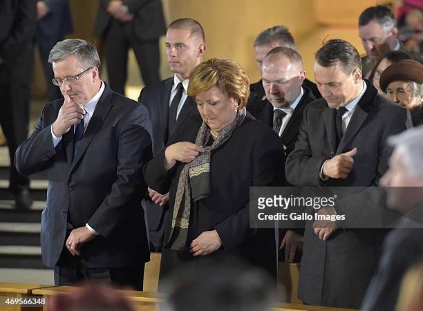 President Bronislaw Komorowski, First Lady Anna Komorowska and Marshal of the Sejm, Radoslaw Sikorski attend the Holy Mass for the victims of the...