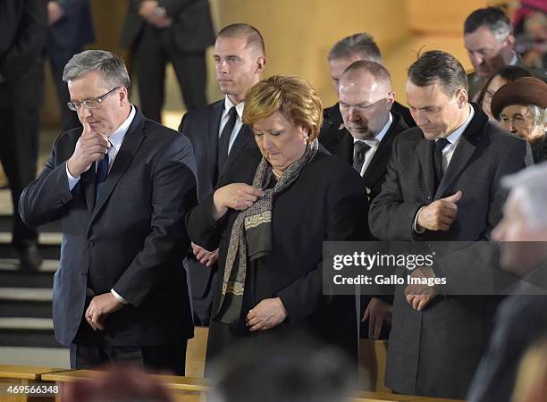 President Bronislaw Komorowski, First Lady Anna Komorowska and Marshal of the Sejm, Radoslaw Sikorski attend the Holy Mass for the victims of the...