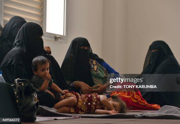 Yemeni women sit with their children on April 12, 2015 at a boarding facility run by the UN High Commission for Refugees in Obock, a small port in...