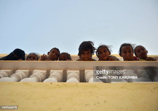 Yemeni refugee children stand on April 12, 2015 at a boarding facility run by the UN High Commission for Refugees in Obock, a small port in Djibouti...