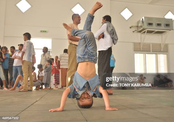 Yemeni refugees play on April 12, 2015 at a boarding facility run by the UN High Commission for Refugees in Obock, a small port in Djibouti on the...