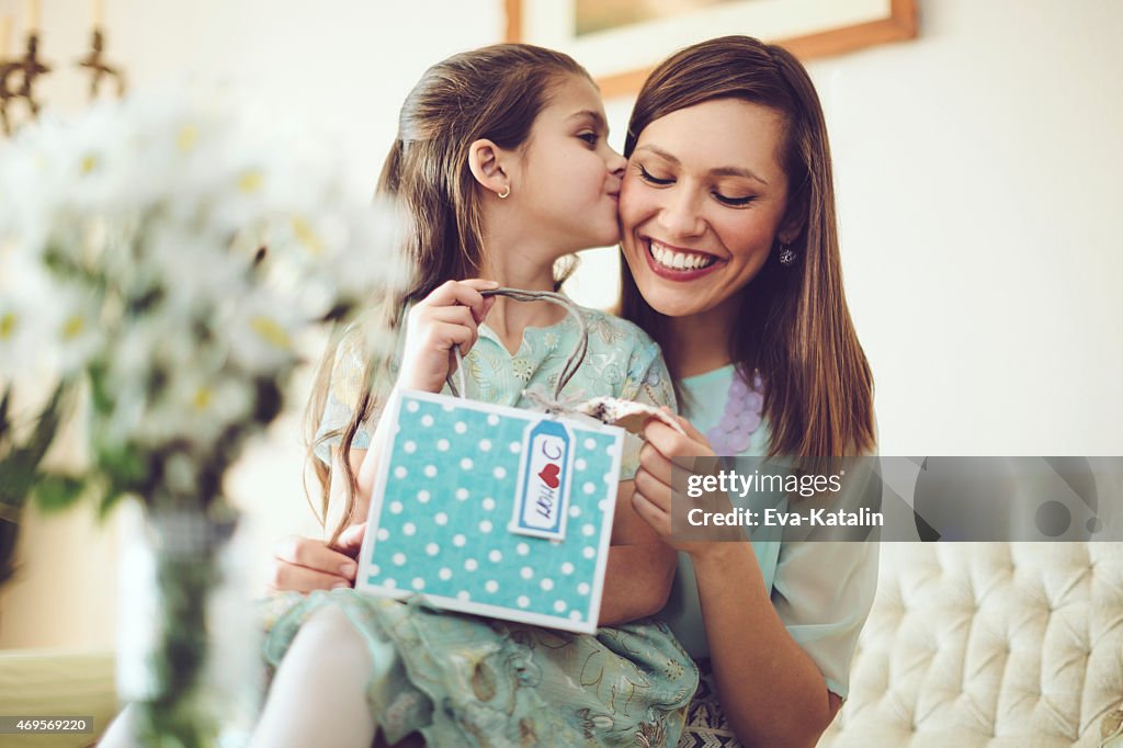 Happy mother posing with her daughter