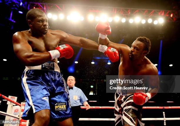 Dereck Chisora of Great Britain in action with Kevin Johnson of USA during their WBO and WBA International Heavyweight Championship bout at The...