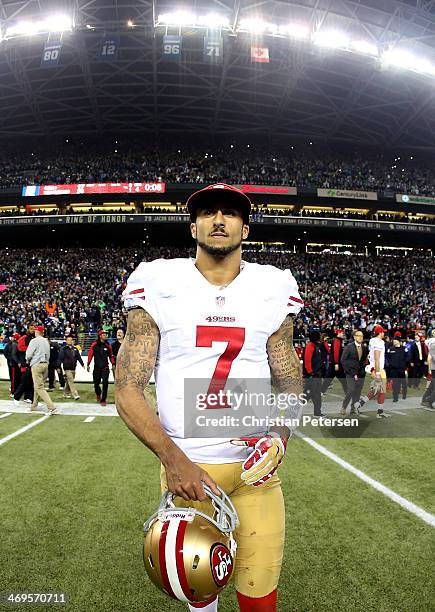 Quarterback Colin Kaepernick of the San Francisco 49ers walks off the field after losing to the Seattle Seahawks 23-17 during the 2014 NFC...