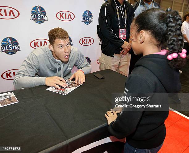 Blake Griffin of the Los Angeles Clippers signs autographs at the Kia MVP court during the 2014 NBA All-Star Jam Session at the Ernest N. Morial...