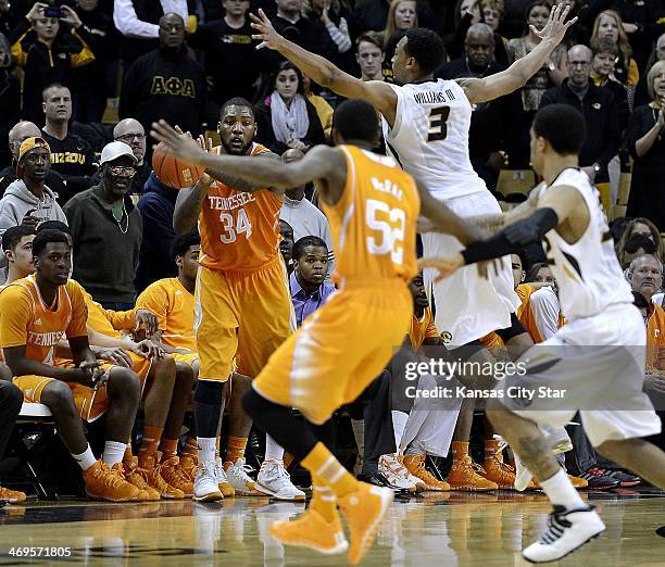 On Tennessee's last possession, Jeronne Maymom tries to inbound the ball to teammate Jordan McRae , but Missouri's Jabari Brown, right, steps in to...