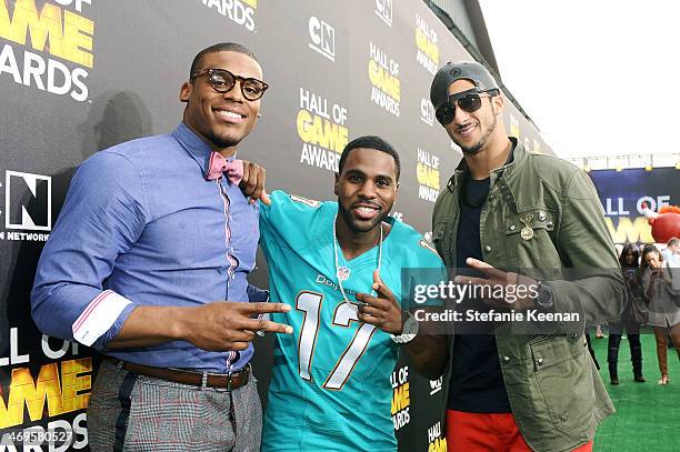 Quarterback Cam Newton of the Carolina Panthers, singer Jason Derulo, and quarterback Colin Kaepernick of the San Francisco 49ers attend Cartoon...