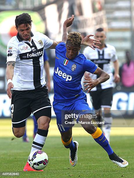 Kingsley Coman of Juventus FC competes for the ball with Pedro Mendes of Parma FC during the Serie A match between Parma FC and Juventus FC at Stadio...