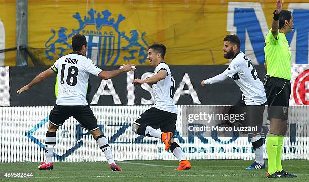 Jose Mauri of Parma FC celebrates with his team-mates Massimo Gobbi and Antonio Nocerino after scoring the opening goal during the Serie A match...