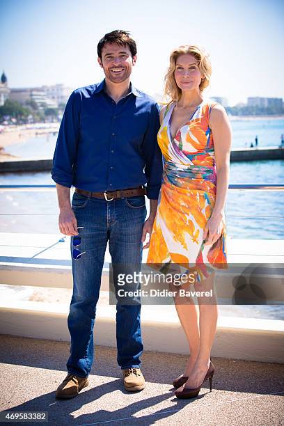 Goran Visnjic and Elizabeth Mitchell pose during the 'Crossing Lines - The Time Is Now' photocall at MIPTV on April 13, 2015 in Cannes, France.