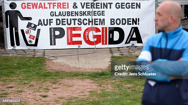 People attend a weekly Pegida demonstration on April 13, 2015 in Dresden, Germany. A large number of supporters and opponents are expected to attend...
