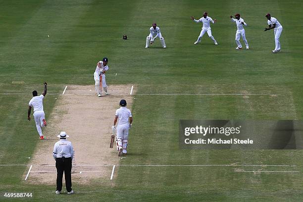 Alastair Cook of England is bowled by Kemar Roach of West Indies during day one of the 1st Test match between West Indies and England at the Sir...