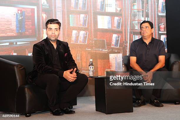 Indian entrepreneur Ronnie Screwvala and filmmaker Karan Johar at the launch of his book Dream With Your Eyes Open on April 8, 2015 in New Delhi,...