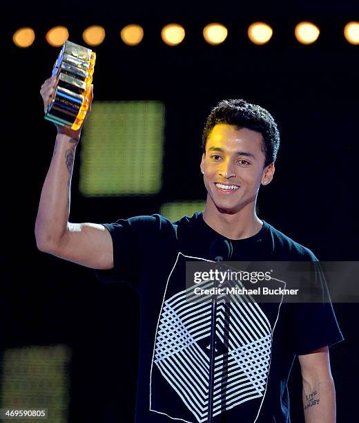 Pro skateboarder Nyjah Huston accepts the Alti-Dude award onstage during Cartoon Network's fourth annual Hall of Game Awards at Barker Hangar on...