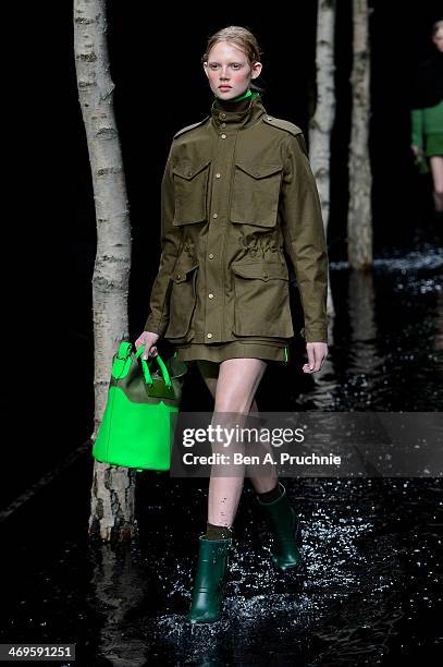 Model walks the runway at the Hunter Original show at London Fashion Week AW14 at University of Westminster on February 15, 2014 in London, England.