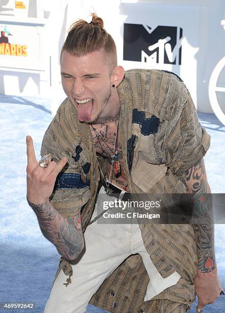 Machine Gun Kelly attends The 2015 MTV Movie Awards at Nokia Theatre L.A. Live on April 12, 2015 in Los Angeles, California.