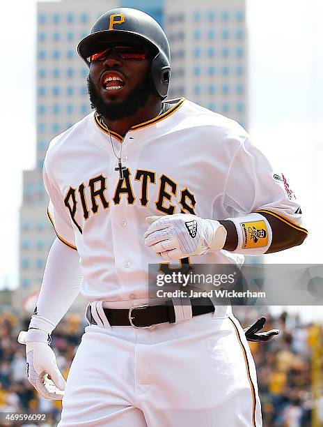 Josh Harrison of the Pittsburgh Pirates celebrates his solo home run in the first inning against the Detroit Tigers during the Opening Day game at...