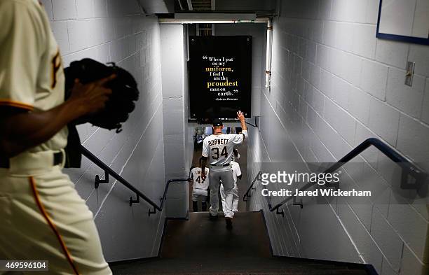 Burnett of the Pittsburgh Pirates walks down the stairs past the Roberto Clemente quote on the wall before entering the field against the Detroit...