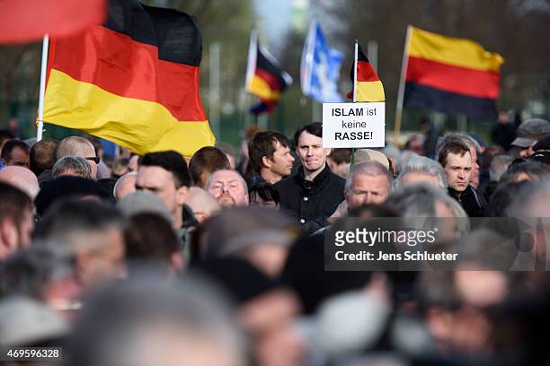 Supporters of the German anti-Islam movement Pegida attend a weekly Pegida demonstration on April 13, 2015 in Dresden, Germany. A large number of...