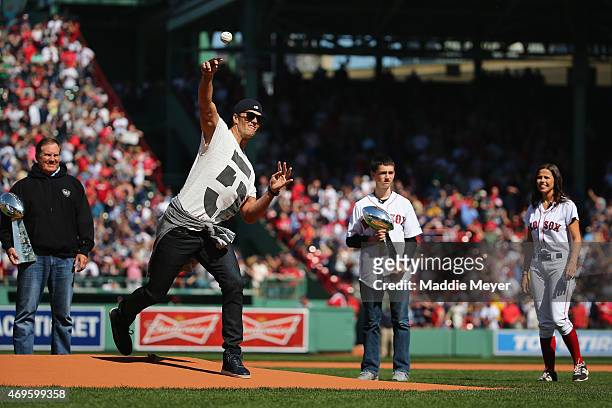 New England Patriots quarterback Tom Brady throws the first pitch before the game between the Washington Nationals and the Boston Red Sox at Fenway...