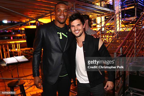 Co-host Cam Newton and actor Taylor Lautner attend Cartoon Network's fourth annual Hall of Game Awards at Barker Hangar on February 15, 2014 in Santa...