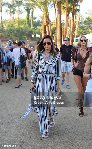 Jamie Chung wears Teva Flatform Universal Sandals to the 2015 Coachella Valley Music Festival at the Empire Polo Fields on April 12, 2015 in Indio,...