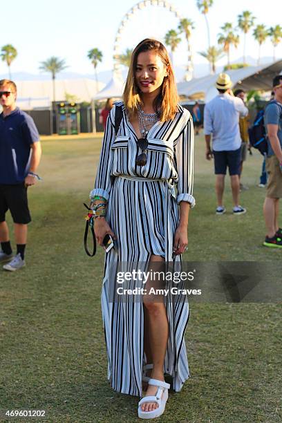 Jamie Chung wears Teva Flatform Universal Sandals to the 2015 Coachella Valley Music Festival at the Empire Polo Fields on April 12, 2015 in Indio,...