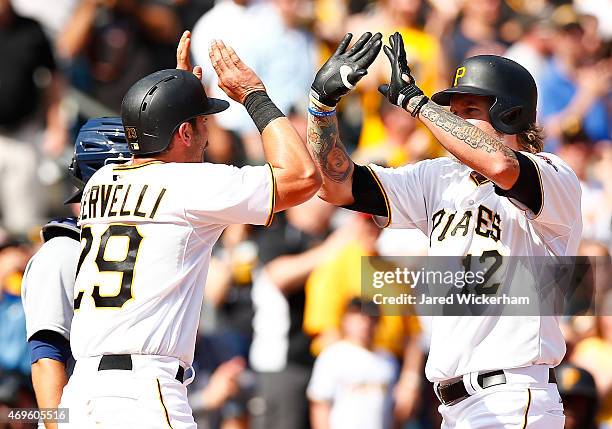 Corey Hart is congratulated by teammate Francisco Cervelli of the Pittsburgh Pirates following his two-run home run in the seventh inning against the...