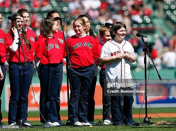 Jane Richard sang with a children's choir during the Red Sox home opener at Fenway Park in Boston on April 13, 2015.
