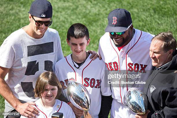Henry and Jane Richard, the older brother and younger sister of Boston Marathon bombing victim Martin Richard, are surrounded by Red Sox designated...