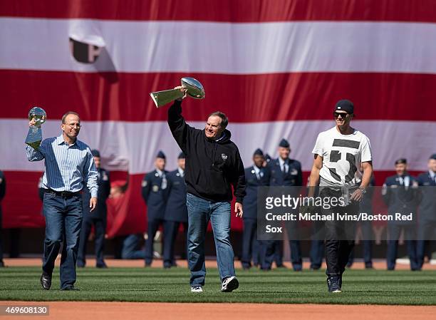 New England Patriots President Jonathan Kraft, coach Bill Belichick , and quarterback Tom Brady take the field during a ceremony honoring the 2015...