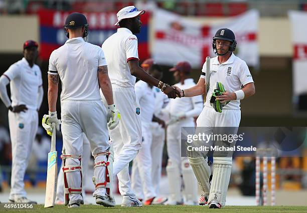 Ian Bell of England is congratulated by Sulieman Benn of West Indies after being dismissed for 143 runs during day one of the 1st Test match between...