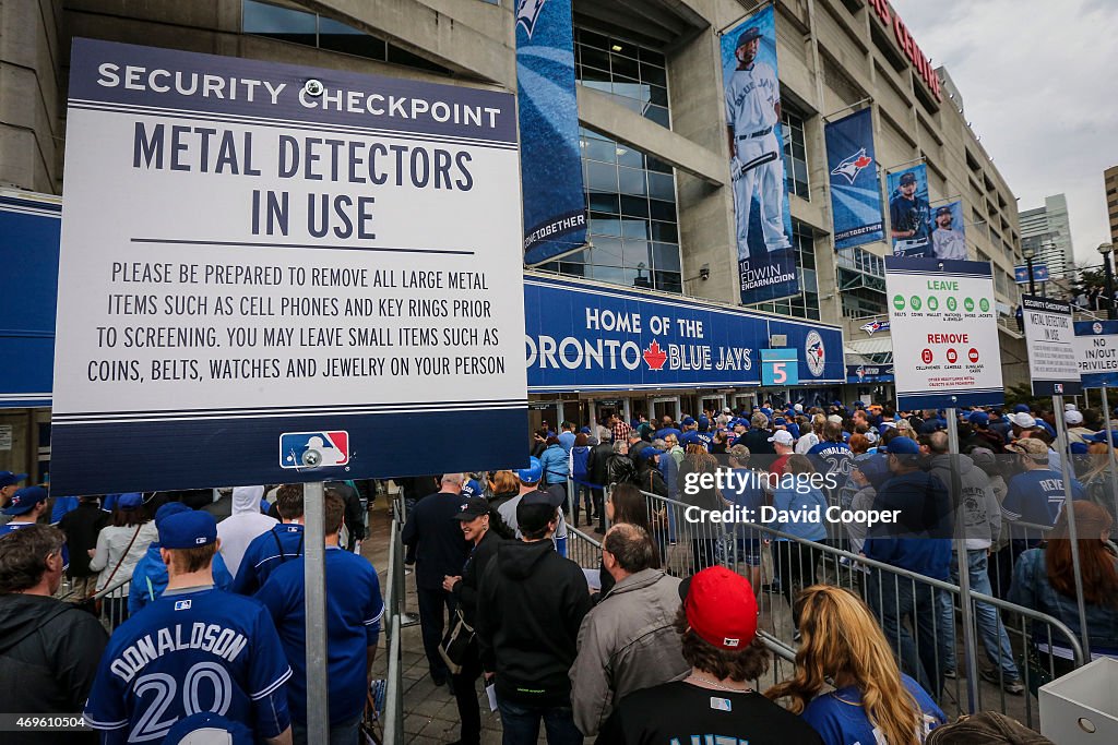 Fans lineup at gate 5-6 to pass thru the metal detectors at the home opener