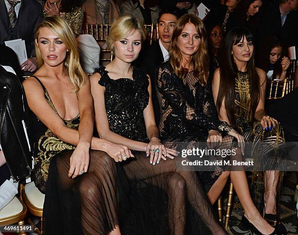 Abbey Clancy, Nina Nesbitt, Millie Mackintosh and Zara Martin attend the Julien Macdonald show at London Fashion Week AW14 at the Royal Courts of...