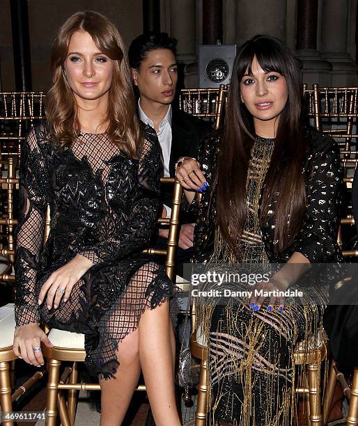 Millie Mackintosh and Zara Martin attend the Julien Macdonald show at London Fashion Week AW14 at on February 15, 2014 in London, England.