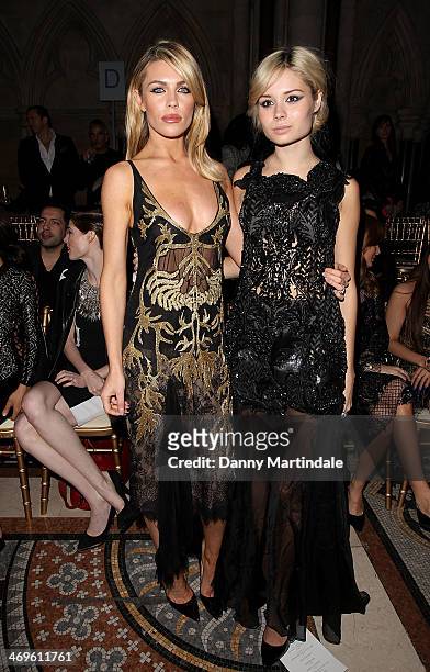 Abbey Clancy and Nina Nesbitt attend the Julien Macdonald show at London Fashion Week AW14 at on February 15, 2014 in London, England.