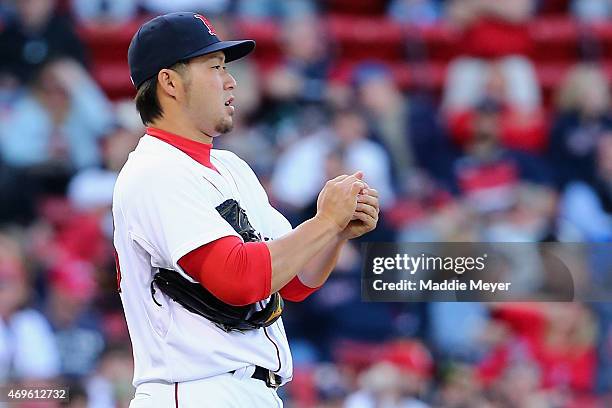 Junichi Tazawa of the Boston Red Sox prepares to pitch against the Washington Nationals during the ninth inning at Fenway Park on April 13, 2015 in...