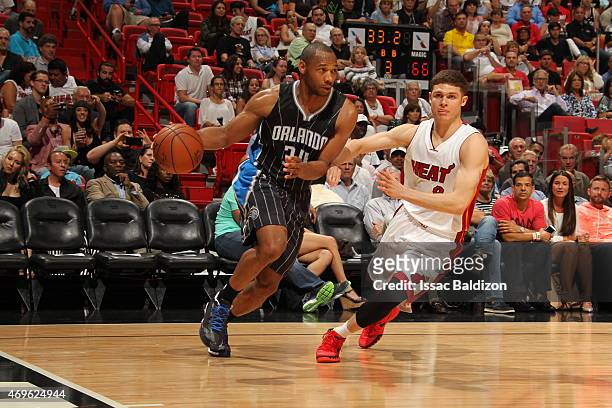 Willie Green of the Orlando Magic drives to the basket against Tyler Johnson of the Miami Heat on April 13, 2015 at American Airlines Arena in Miami,...