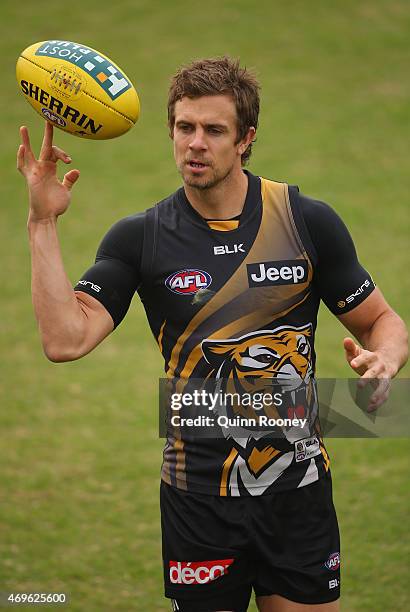 Brett Deledio of the Tigers spins a ball on his finger during a Richmond Tigers AFL training session at ME Bank Centre on April 14, 2015 in...