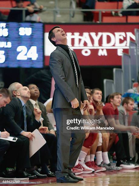 Head coach Ken Bone of the Washington State Cougars looks to the scoreboard during the game against the Stanford Cardinal at Beasley Coliseum on...