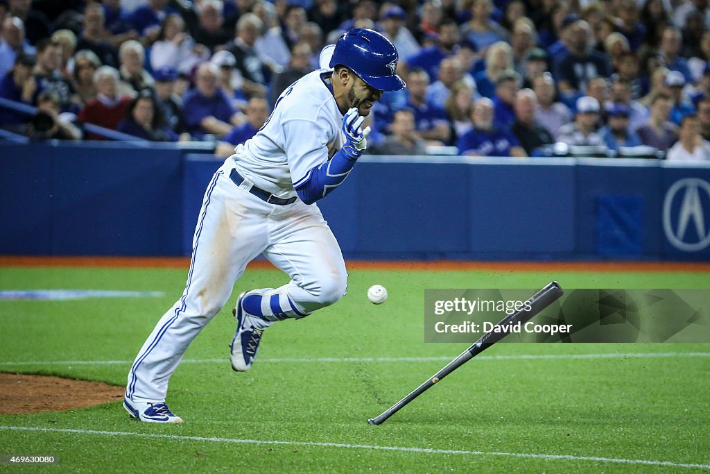 Devon Travis (29) of the Toronto Blue Jays legs out a ground ball in the bottom of the 8th