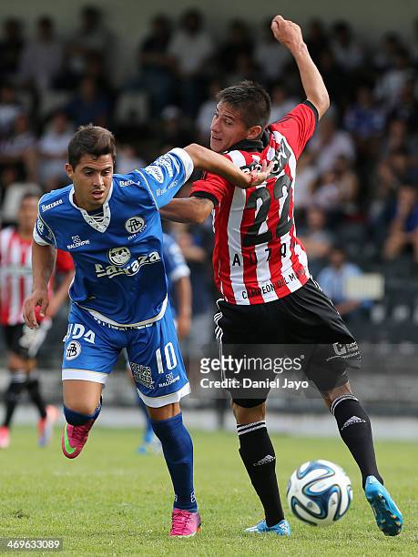 Alejandro Barbaro of All Boys fights for the ball with Carlos Auzqui of Estudiantes during a match between All Boys and Estudiantes as part of Torneo...