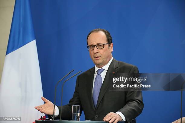 French President Francois Hollande holds a speech during press conference with Chancellor Angela Merkel at Chancellery.