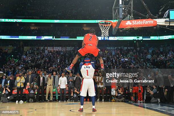 John Wall of the Washington Wizards dunks over the Wizards mascot during the Sprite Slam Dunk Contest on State Farm All-Star Saturday Night as part...