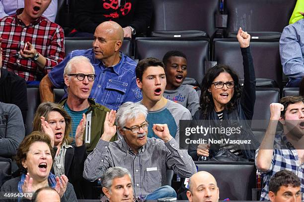 Brad Hall, Charles Hall and Julia Louis-Dreyfus attend a basketball game between the Denver Nuggets and the Los Angeles Clippers at Staples Center on...