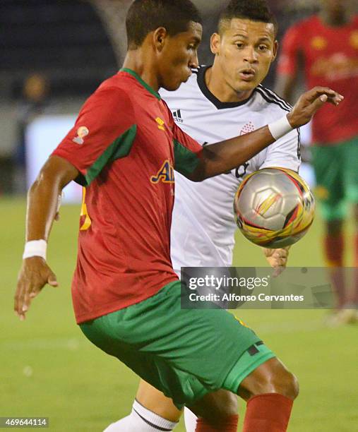 Gabriel Fuentes of Barranquilla and Ayron Del Valle of America de Cali fight for the ball during a match between Barranquilla FC and America de Cali...