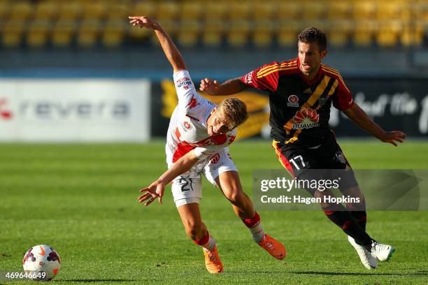 Stefan Mauk of the Heart and Vince Lia of the Phoenix compete for the ball during the round 19 A-League match between Wellington Phoenix and...